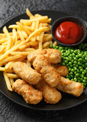 Irish battered sausages with potato fries, green peas and ketchup - obrazy, fototapety, plakaty