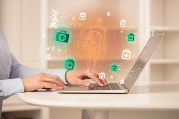 Doctor working on laptop with healthcare concept