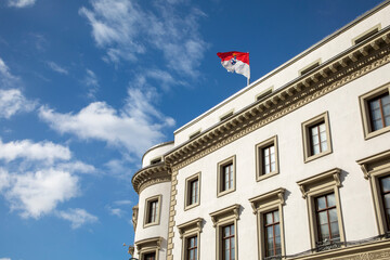 view to parliament of Hesse in Wiesbaden, a former castle, with Hesse Flag at roof top - obrazy, fototapety, plakaty