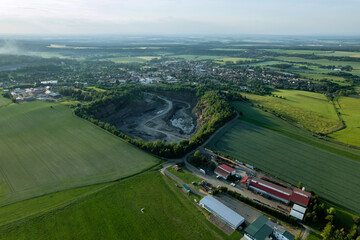 Big quarry, stone extraction, special equipment for working in quarries, quarry trucks, territory of crushed stone factories top view.