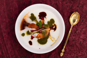 Dahi Bhalla Also Called Dahi Vada, Dahi Bhalle Or Dahi Bada Are Fried Lentil Dumplings Made Of Soaked Split Urad Dal And Moong Daal Topped With Whip Curd, Masala Powder, Meethi, Hari Pudina Chutney