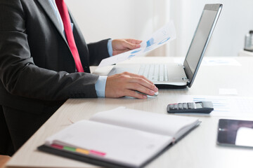 Man working on a computer in his office