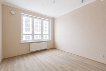Empty gray room ready for people to move in
