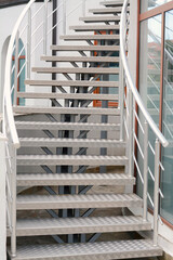 View of beautiful metal stairs with railings outdoors