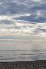 Photo of the sea and sky full of clouds 