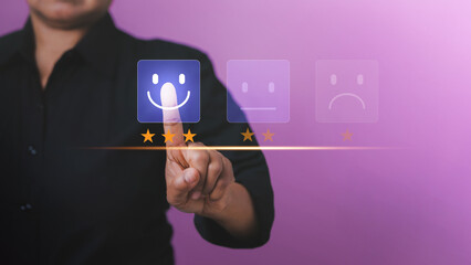 Customer service and Satisfaction, Businessman Hand choosing screen on happy Smiley face icon to give satisfaction. Concept of customer service and satisfaction. Customer service evaluation,rating