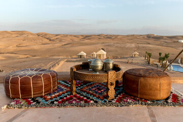 traditional dinner place setting in remote Agafay Desert near Marrakesh Morocco - obrazy, fototapety, plakaty