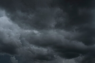 Dramatic dark storm thundercloud rain clouds on black sky background. Dark thunderstorm clouds...