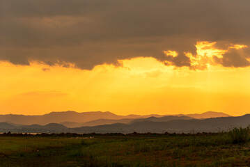 Sunset mountain range beautiful landscape mist, dusk golden time dramatic sky. Beautiful landscape high mountain ridge mist panning panorama scenery dawn dramatic sky. Sunrise landscape mountain peak.
