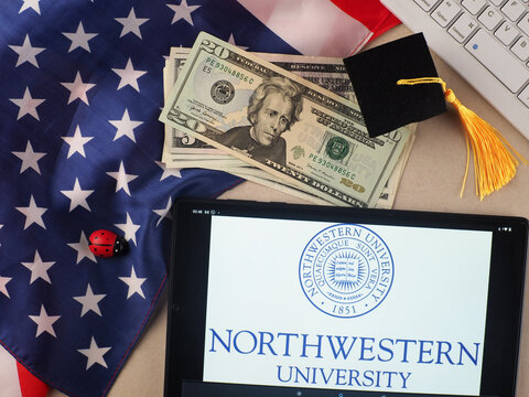 IIn this photo illustration, Northwestern University  logo seen displayed on a tablet.