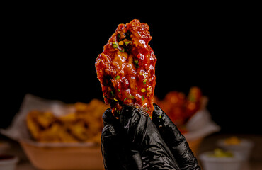 Tempting chicken wings with BBQ sauce and crispy texture  © Paulo