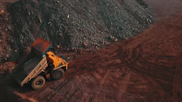Industrial mining ore iron metal mineral quarry truck heavy care dump truck loading transport ore
