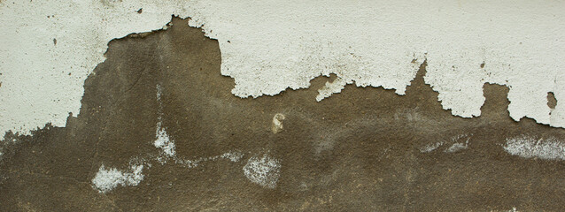 White paint peeling off the old wall texture background.