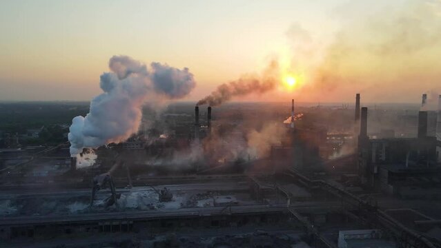 industry metallurgical plant sunrise bad ecology chimney smoke aerial 4K