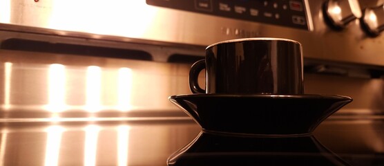cup of coffee on a cooking stove