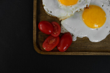 Fried eggs with tomatoes