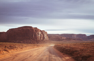 road in monument valley at sunset