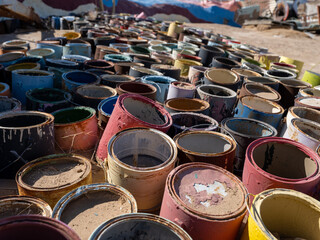 Colorful weathered paint cans in group