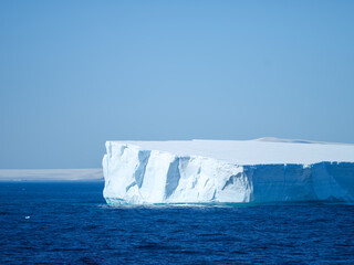 Iceberg in blue water
