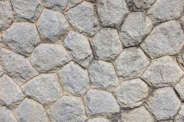 Stone background in a resort gives a feeling of solidity, strength, luxury.