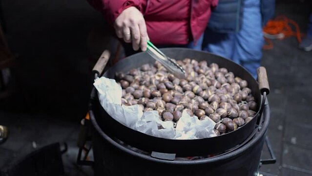 Making chestnuts streetfood wintertime Christmas market