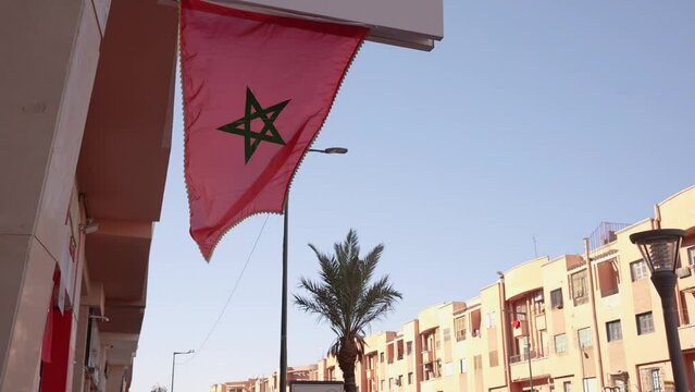 Flag of Morocco waving in the city