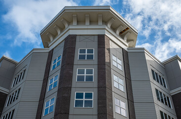 Modern apartment buildings on a sunny day with a blue sky. Facade of a modern apartment building. New apartment building
