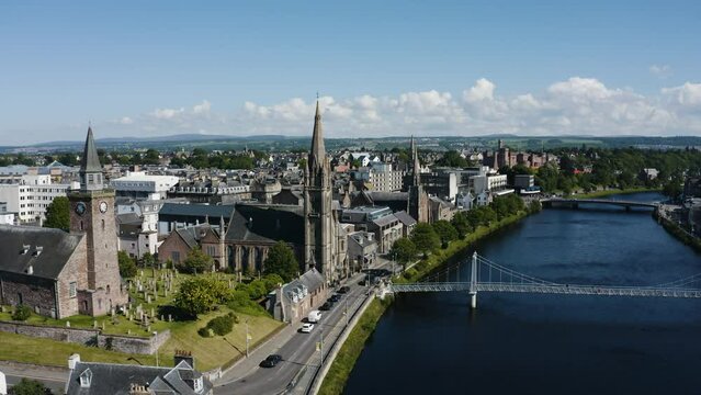 Drone shot pulling away from the Free Church of Scotland to reveal the surrounding city of Inverness.