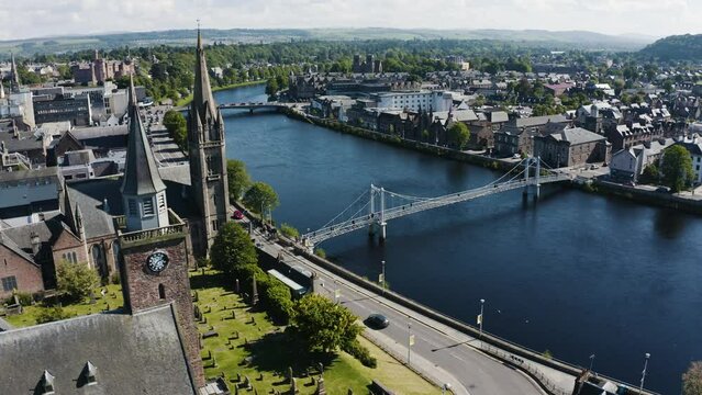 Aerial shot of churches lining the River Ness in Scotland's Inverness region.