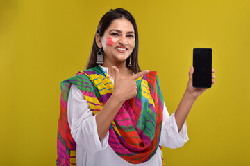 Portraits of  Young Woman celebrating holi