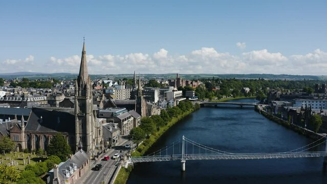 Drone shot of the River Ness in Inverness, Scotland with the Greig St Bridge in the foreground.
