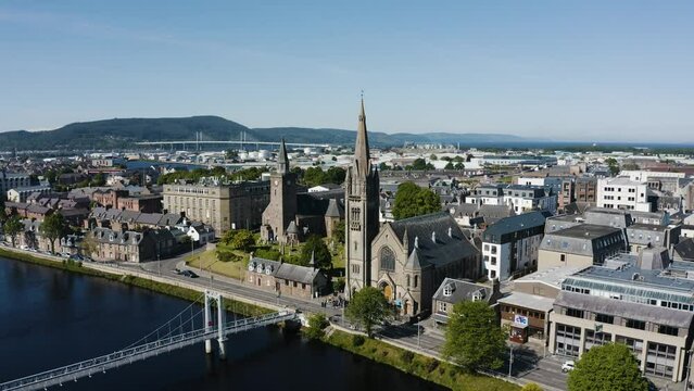 Drone shot pulling away from the Free Church of Scotland building in downtown Inverness.