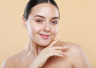 Beautiful face of young white woman with a clean skin. Skin care concept.