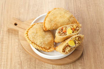 Jalangkote, Indonesian traditional snack filled with egg, carrot, potato, rice noodles. Served with chili sauce
