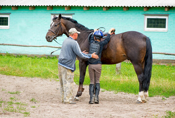 Horseback riding. Sports activities at the racetrack.