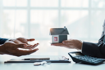 Real estate company to buy houses and land are delivering keys and houses to customers after...