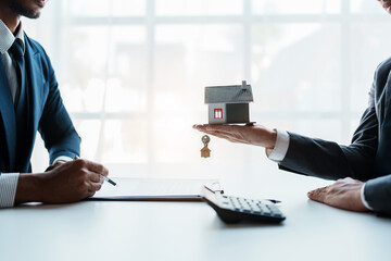 Real estate company to buy houses and land are delivering keys and houses to customers after...