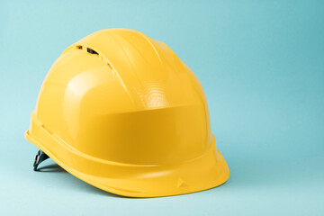 Construction helmet yellow on a blue background. Construction concept