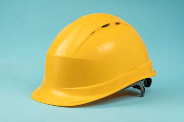 Construction helmet yellow on a blue background. Construction concept