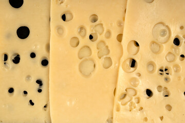 Texture of Radomer cheese close-up on a black background