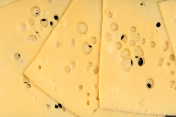 Texture of Radomer cheese close-up on a black background