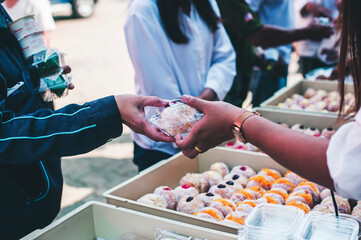 Volunteers are giving free food to help the hungry poor : concept of food sharing