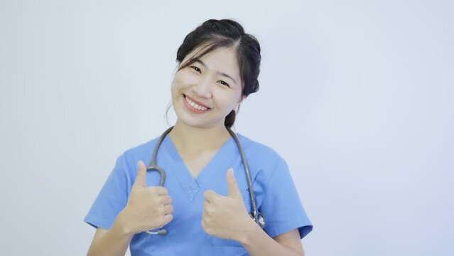 Stock video of Asian female doctor raising her hand showing great
