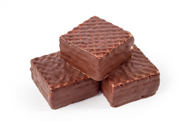 Glazed chocolate waffles on a white background. A bunch of waffle bars. Confectionery close-up.