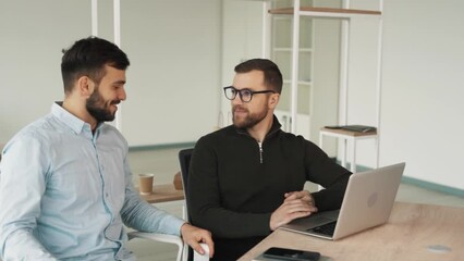 In the office, a man with a laptop confesses his homosexuality and openly declares his love for another man