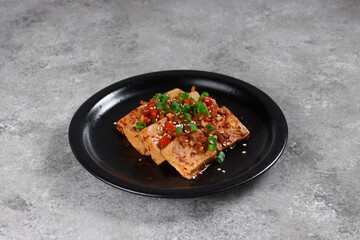 Obraz na płótnie Canvas Dubu Jorim is a Korean Braised Tofu. Fried Tofu with Soy Sauce and chillies.