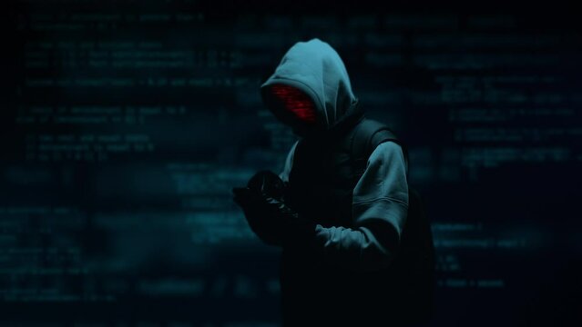 Computer hacker with phone. Computer abstract digital code at the background. Darknet fraud and cryptocurrency bitcoin concept. Cybersecurity and data protection in social network