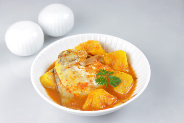 Gulai Nenas is a Malaysian Traditional Dish, Pineapple in Coconut Gravy with Fish. Pineapple Curry with Fish. 