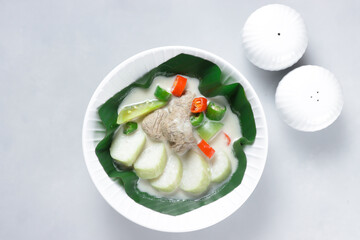 Cok Ganem or Gecok Ganem or Kecok Ganem is an Indonesian Traditional Royal Dish from Yogyakarta, made from Meatball in Coconut Milk Syrup, Dominated by Sour and Spicy Flavors, Served with Rice Cake.