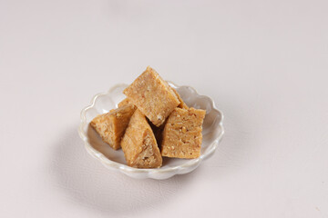 Enting Enting Gepuk is a Traditional Candy from Salatiga Indonesia, made from Crush Peanut and Sugar, Mold into Triangle Shape